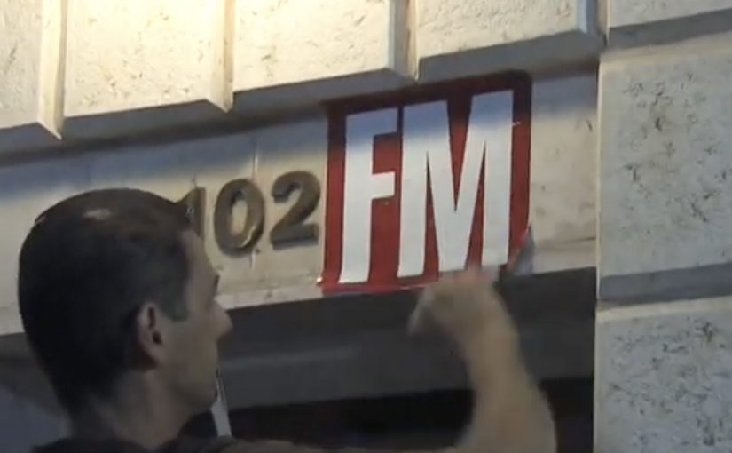 Tel Aviv building number 102 altered with a sticker to read 102FM for Radio Tel Aviv.