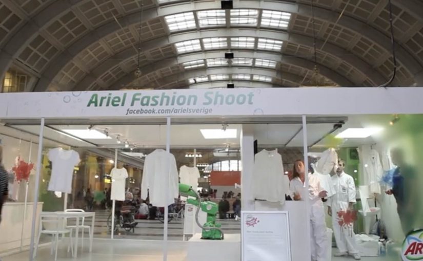 Ariel Actilift interactive fashion shoot at Stockholm Central Station, where Facebook users control stains on designer clothes before they are washed clean on-site.