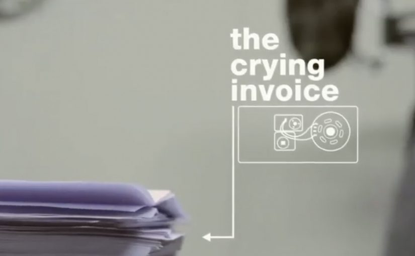 An opened invoice envelope triggers a sound module that starts to cry.