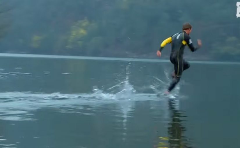 Stunt runner skimming across a lake in Hi-Tec’s “Liquid Mountaineering” film.