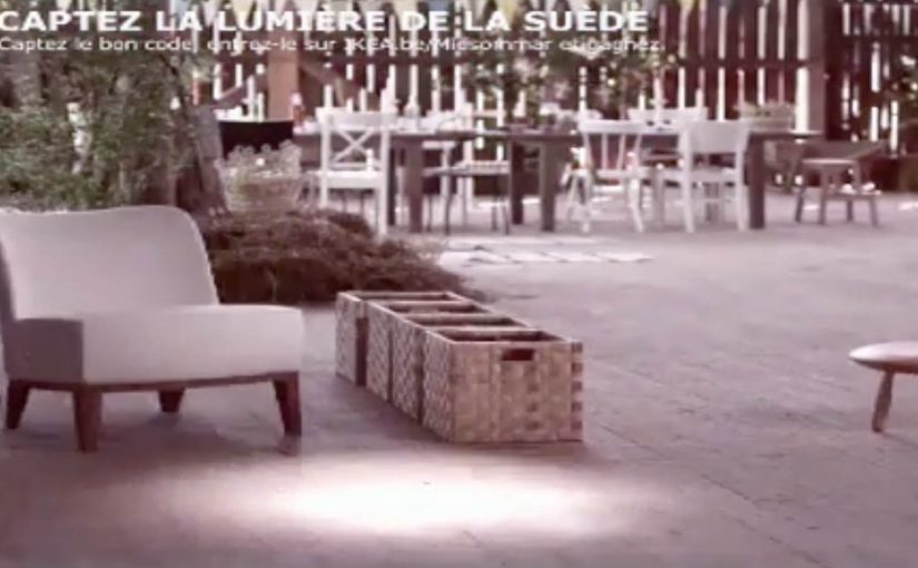 Paused IKEA YouTube game ad with a light beam on a product and a yellow code in the corner.