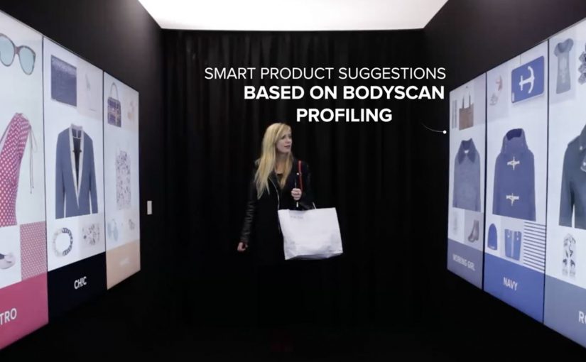 A shopper interacts with personalized product recommendations inside a mall corridor.