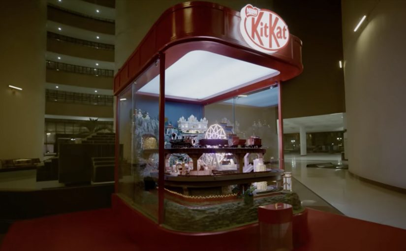 KitKat’s Slooowest Vending Machine installation with a miniature scenic journey inside a red glass vending display.