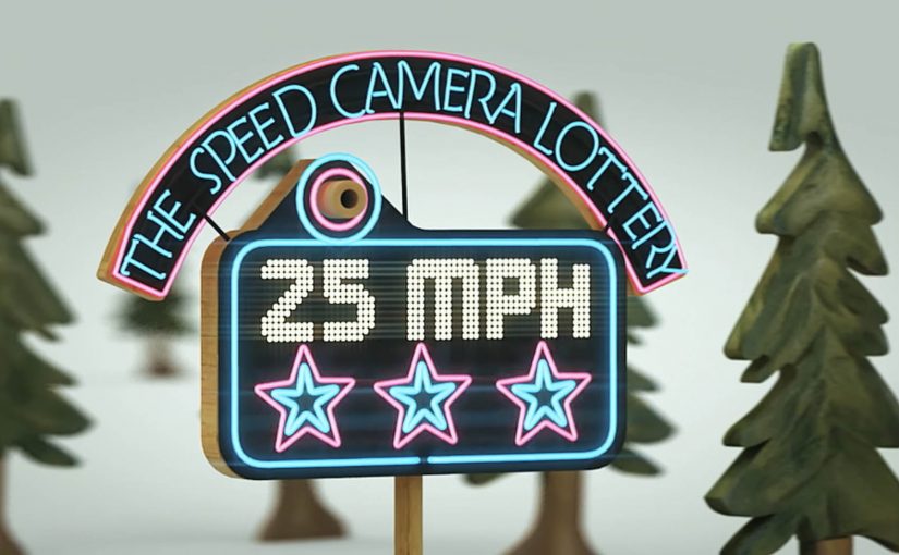 A roadside speed camera promoting a lottery for drivers who obey the speed limit.
