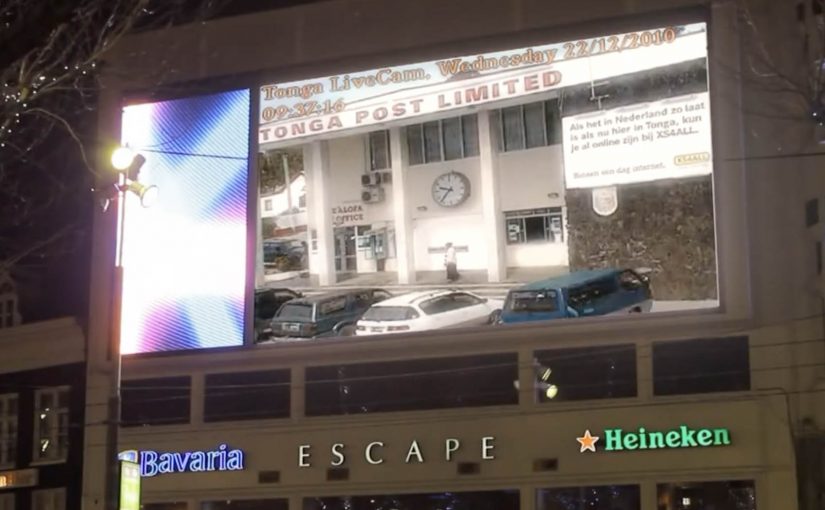XS4ALL Tonga Time billboard and clock visualizing one-day internet installation.